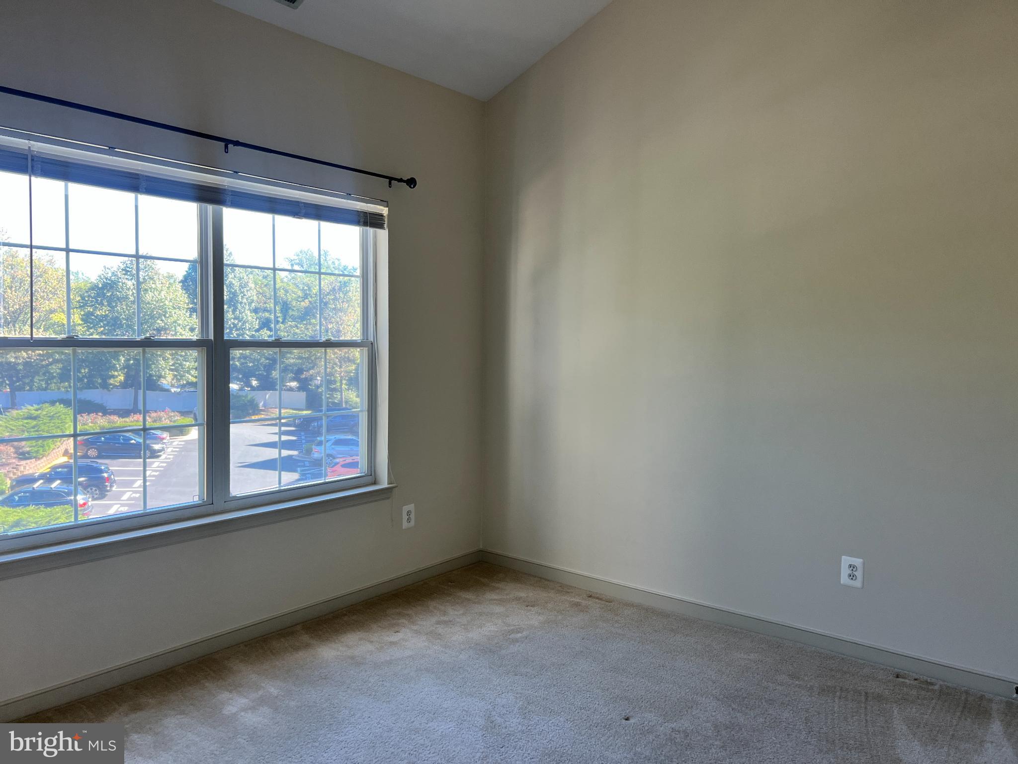 805 Latchmere Court, Unit 302 Annapolis, MD 21401 - Photo 7 of 14 an empty room with a window