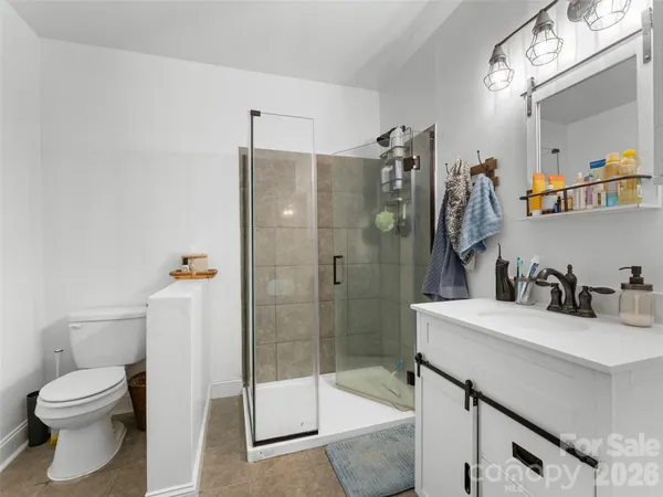 a utility room with sink dryer and washer