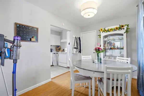 a view of a dining room with furniture and wooden floor