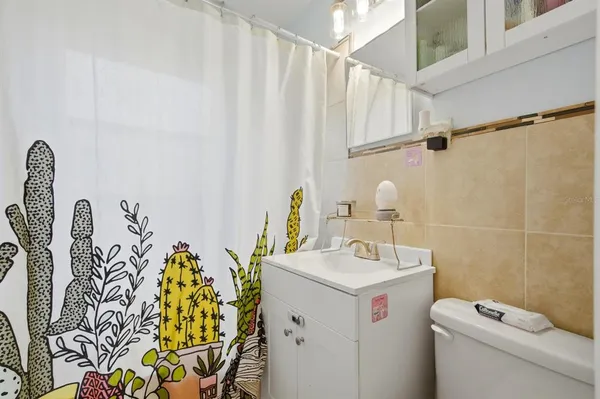 a view of a field with an trees