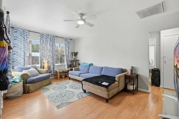 a living room with furniture and a rug