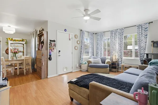 a kitchen with a sink window and cabinets