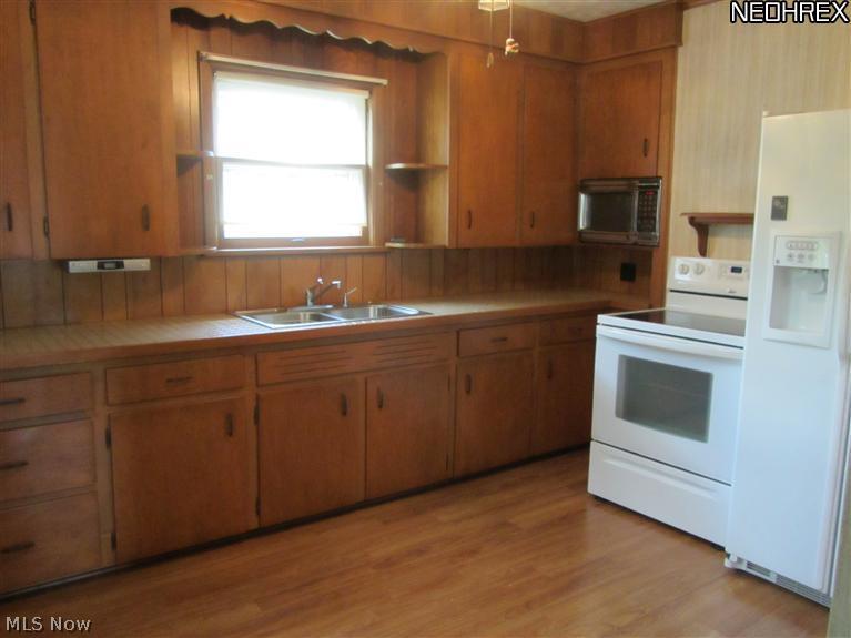 917 Waterloo Road Mogadore, OH 44260 - Photo 8 of 21 The kitchen comes with all appliances.