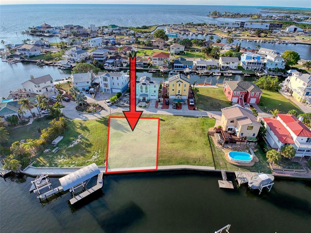 7 Louise Court Hudson, FL 34667 - Photo 5 of 52 an aerial view of a pool with a table and chairs