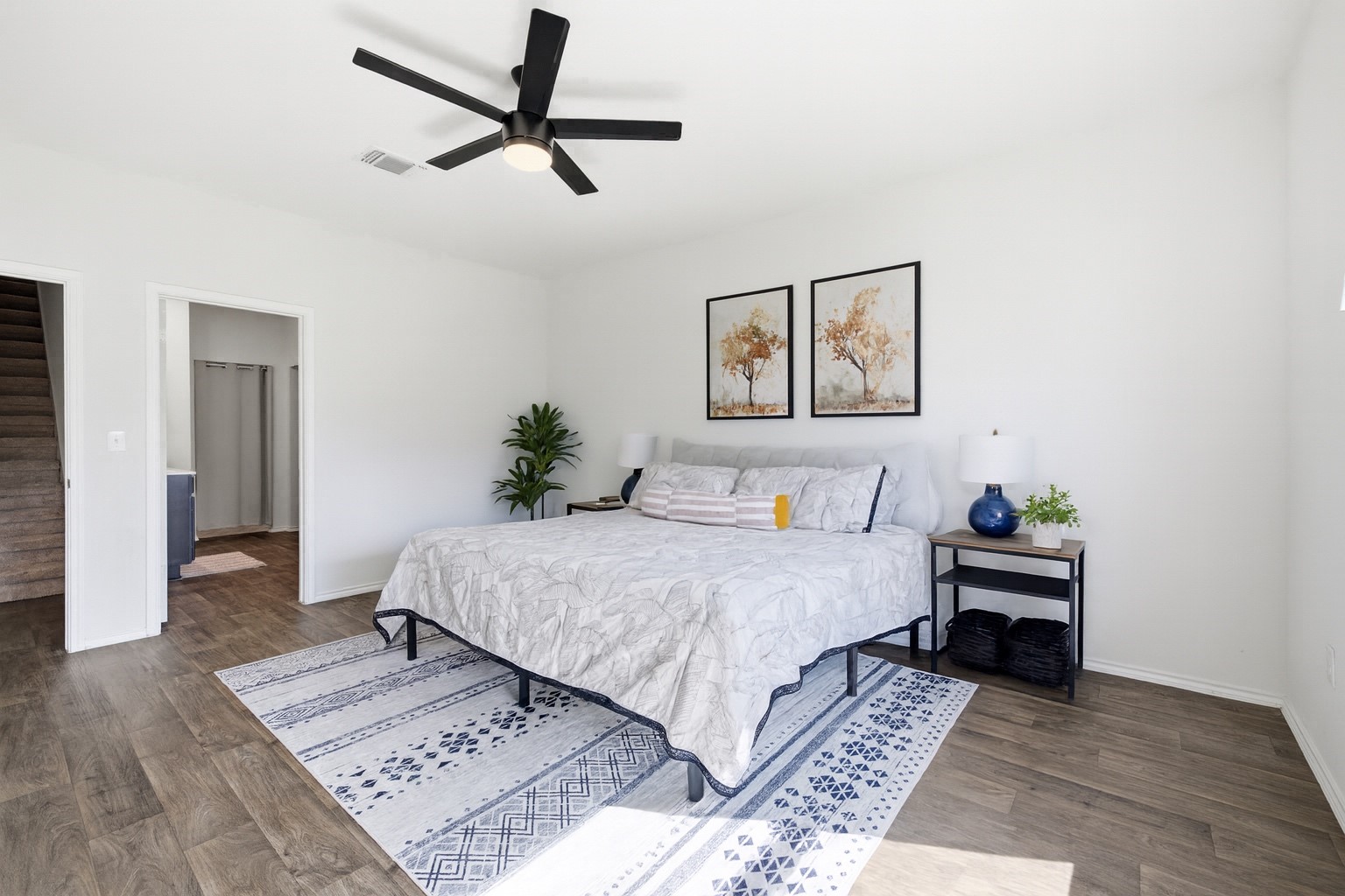 15000 Bajada Rd Manor Manor, TX 78653 - Photo 16 of 31 Hardwood floors and a subtle ceiling fan complete this comfortable bedroom retreat.