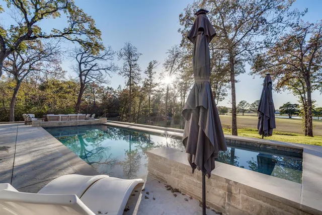 a view of balcony with two chairs and a table