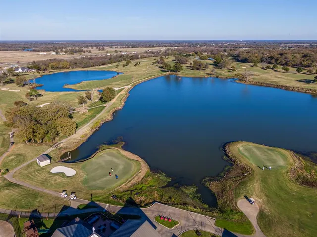 an aerial view of a house with a ocean view