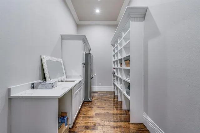 a bathroom with double vanity and mirrors
