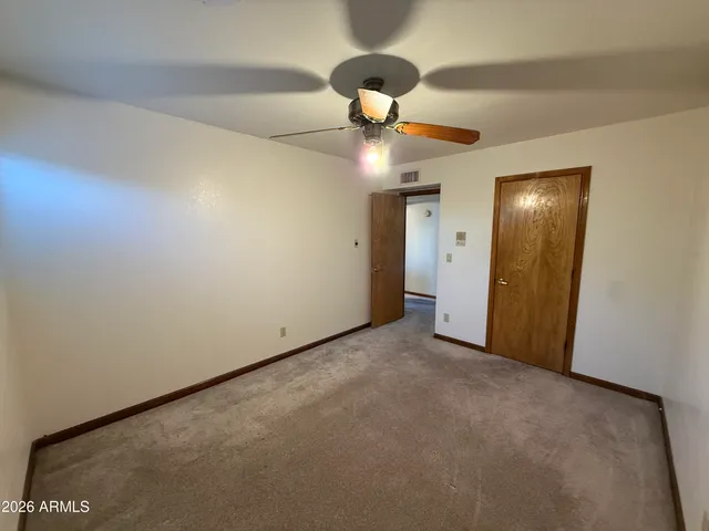 a view of empty room with a fireplace