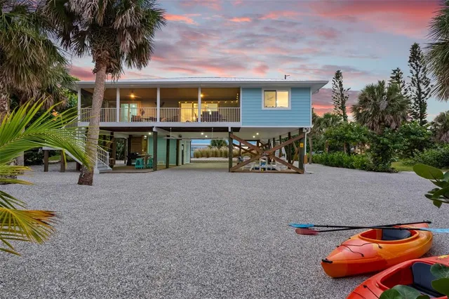 a view of a house with pool and deck