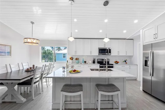 a view of a porch with furniture and a yard