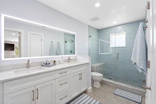 a view of a chairs and table on the wooden deck