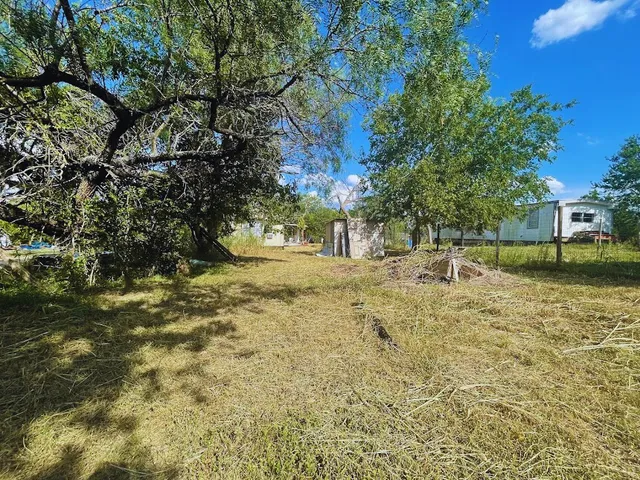 a view of swimming pool with a yard
