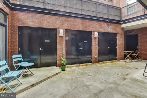 a view of a chair and table in the room
