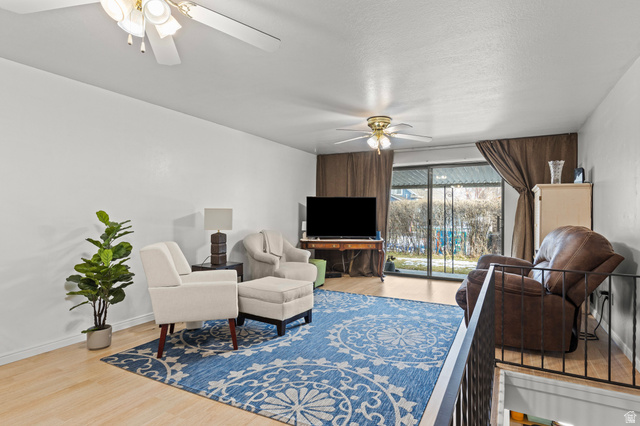 320 North 150 West Logan, UT 84321 - Photo 3 of 22 Living area with light wood-type flooring and a ceiling fan