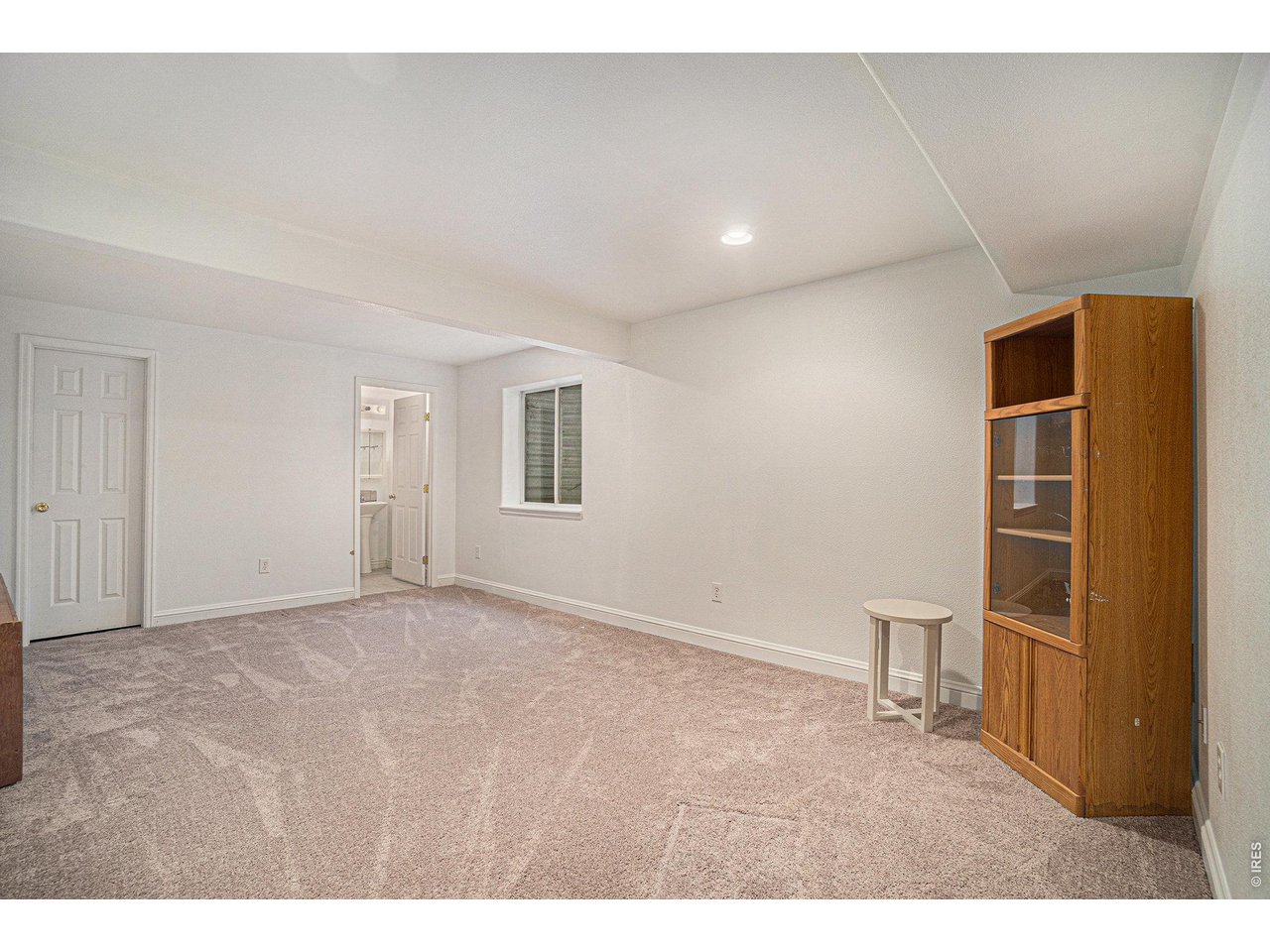 11226 Dover Street Firestone, CO 80504 - Photo 19 of 27 a view of empty room with wooden floor and cabinet