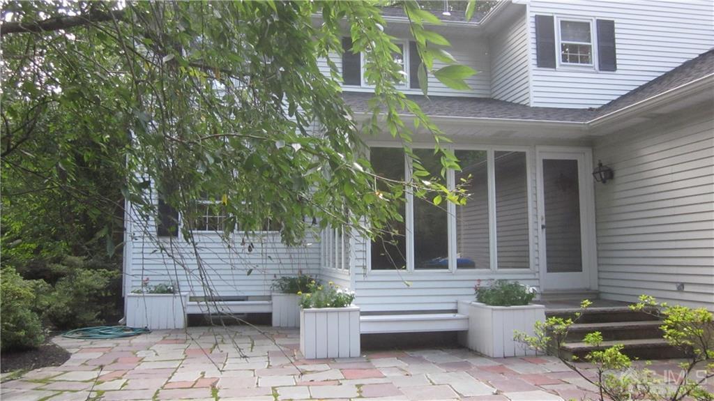 3 Southfield Road Edison, NJ 08820 - Photo 3 of 20 a front view of a house with outdoor seating