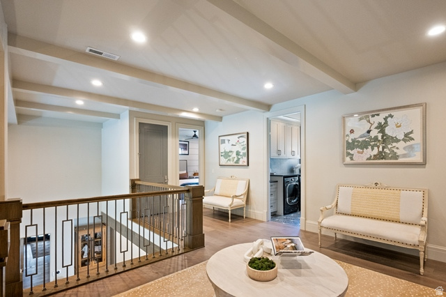 3 Carriagewood Cove, Unit 1088 Sandy, UT 84092 - Photo 32 of 79 Upper level landing featuring wood-finish flooring, exposed ceiling beams, recessed lighting, and a dark wood and metal stair railing