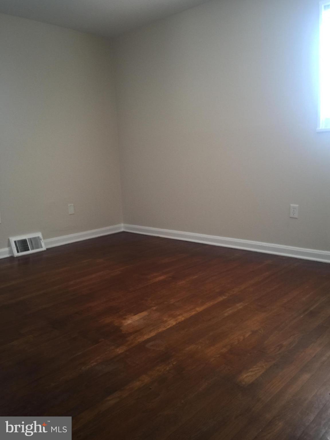 1605 West 7th Street Frederick, MD 21702 - Photo 12 of 19 a view of an empty room with wooden floor