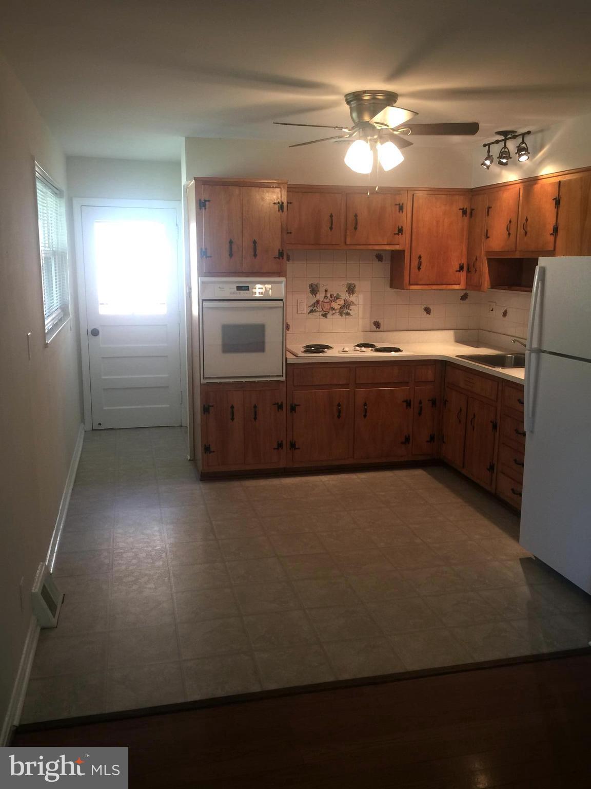 1605 West 7th Street Frederick, MD 21702 - Photo 7 of 19 a large kitchen with cabinets