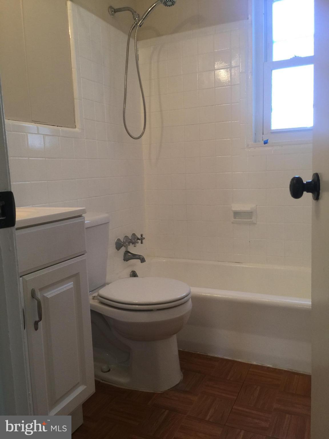 1605 West 7th Street Frederick, MD 21702 - Photo 9 of 19 a bathroom with a sink a toilet and shower