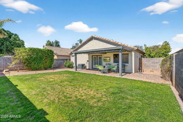 a front view of a house with a garden and porch