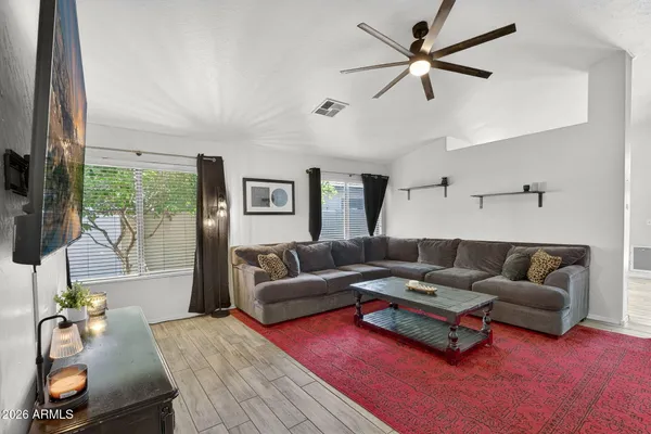 a living room with furniture and a large window