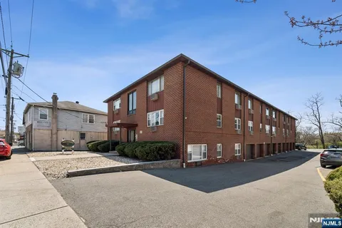 a view of a building with a street