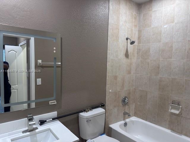 7100 Northwest 177th Street, Unit 100 Hialeah, FL 33015 - Photo 12 of 13 a bathroom with a sink a toilet and shower