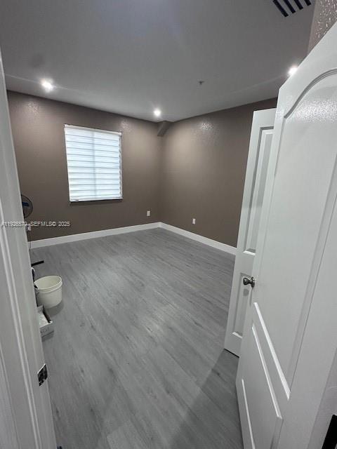 7100 Northwest 177th Street, Unit 100 Hialeah, FL 33015 - Photo 6 of 13 a view of an empty room with a window