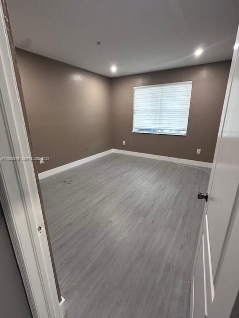7100 Northwest 177th Street, Unit 100 Hialeah, FL 33015 - Photo 9 of 13 an empty room with windows