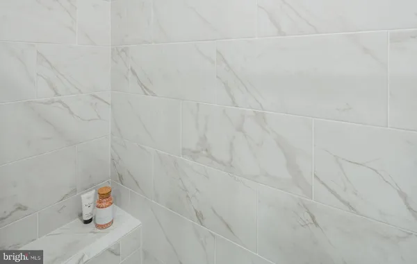 a bedroom with furniture and a chandelier