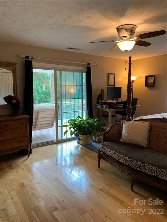 1115 Gouges Branch Road Leicester, NC 28748 - Photo 19 of 48 a living room with furniture and a large window