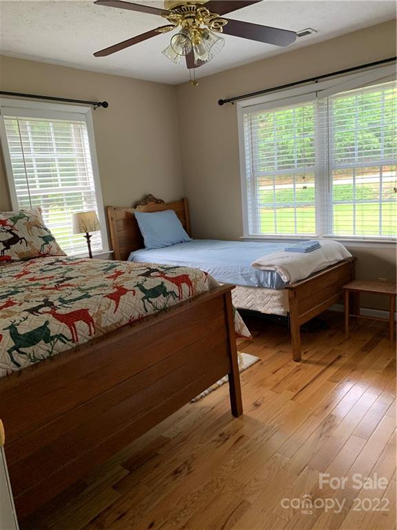 1115 Gouges Branch Road Leicester, NC 28748 - Photo 23 of 48 a bedroom with furniture and a large window