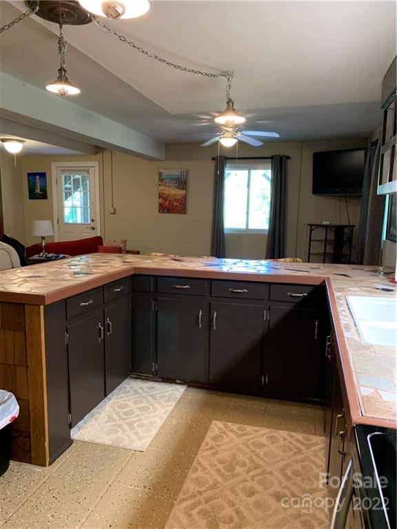 1115 Gouges Branch Road Leicester, NC 28748 - Photo 29 of 48 a kitchen with a sink and a stove top oven