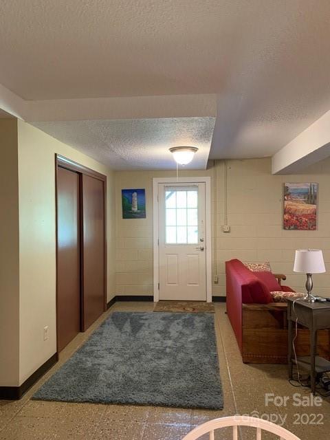 1115 Gouges Branch Road Leicester, NC 28748 - Photo 35 of 48 a view of a livingroom with workspace and a window