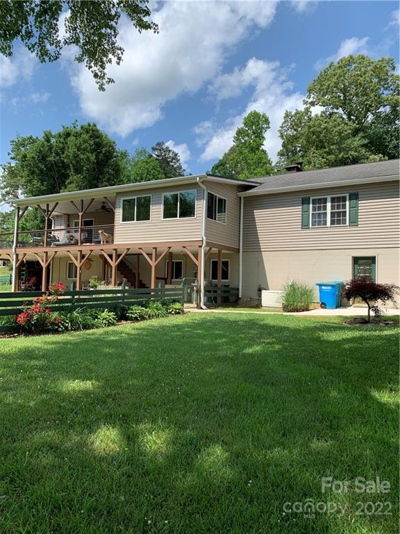 1115 Gouges Branch Road Leicester, NC 28748 - Photo 40 of 48 a front view of a house with a garden and trees