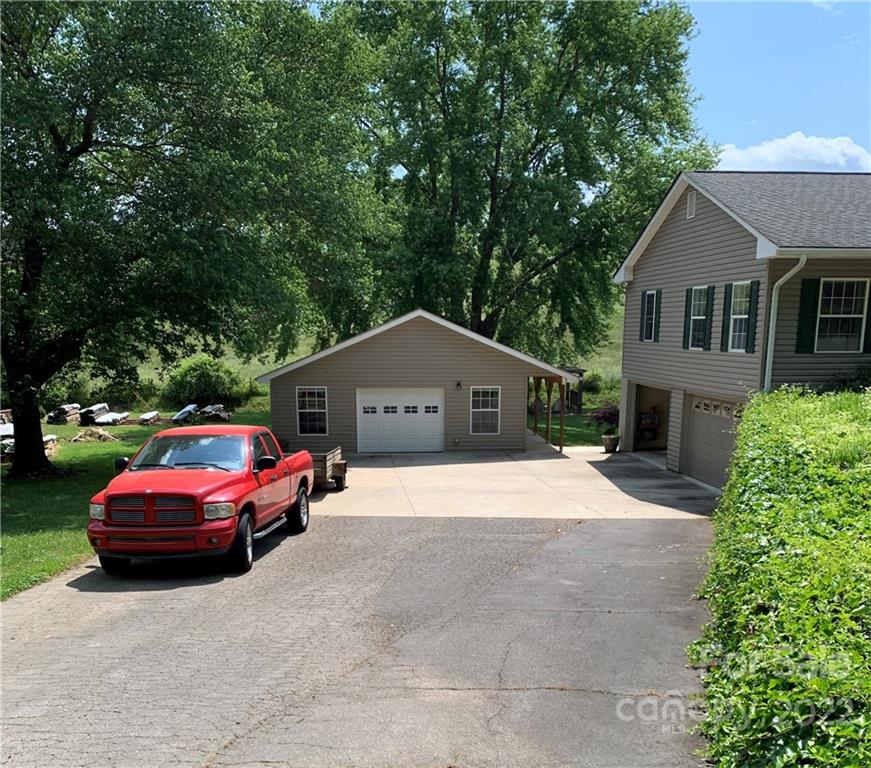 1115 Gouges Branch Road Leicester, NC 28748 - Photo 41 of 48 a house view with a garden space
