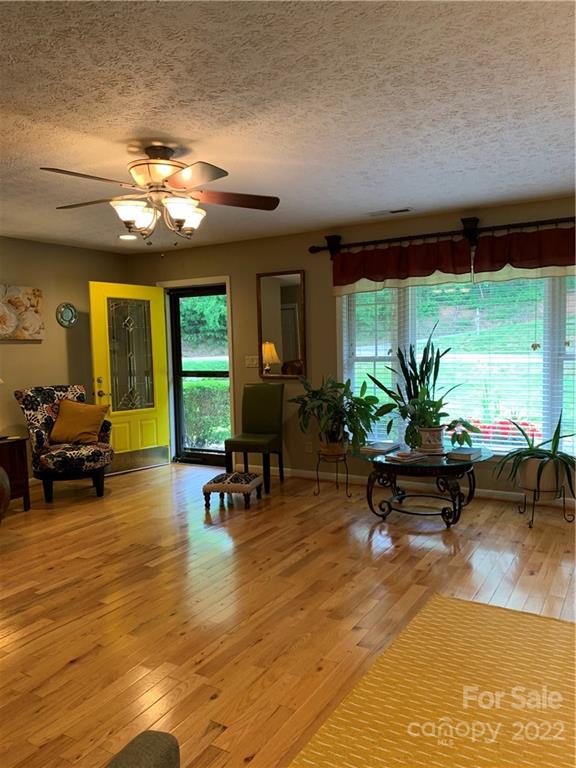 1115 Gouges Branch Road Leicester, NC 28748 - Photo 6 of 48 a living room with furniture and a large window