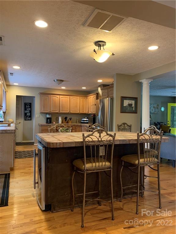 1115 Gouges Branch Road Leicester, NC 28748 - Photo 9 of 48 a kitchen with a table and chairs in it
