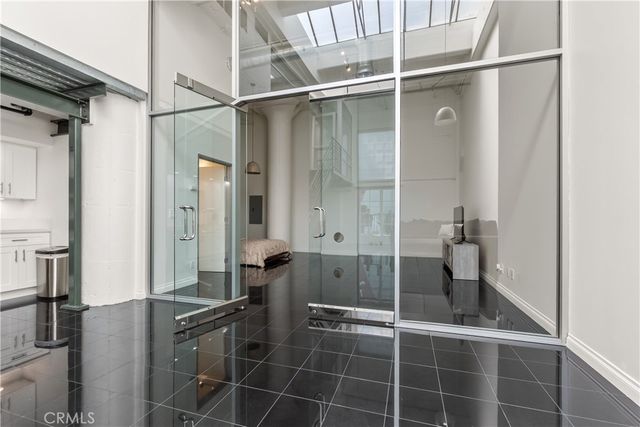 a kitchen with a sink a stove and a refrigerator