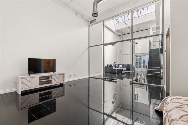 a bathroom with a sink mirror toilet and vanity
