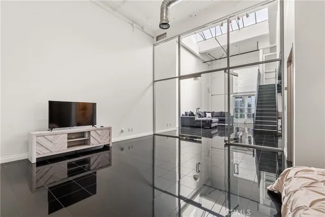 a bathroom with a sink mirror toilet and vanity