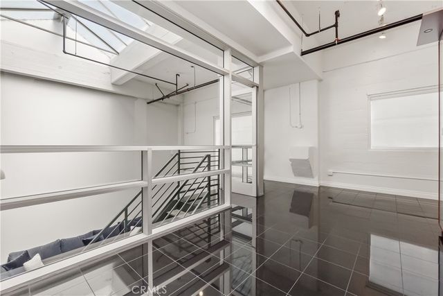 a view of entryway with stairs and wooden floor