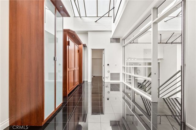 a bathroom with shower and a glass door shower