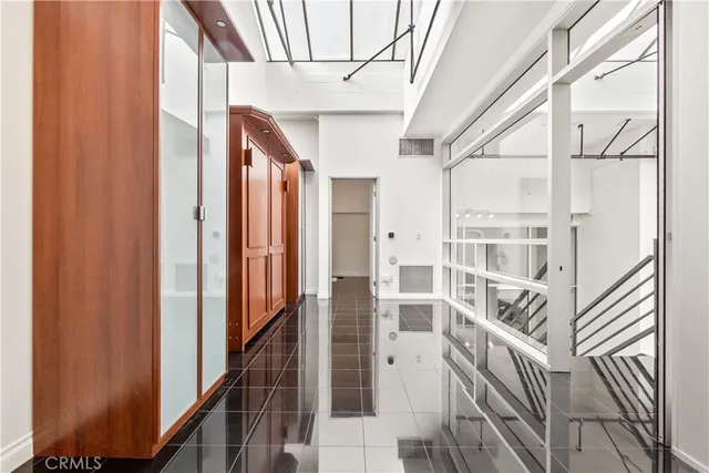 a bathroom with shower and a glass door shower