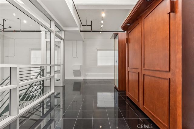 a bathroom with a shower sink and mirror