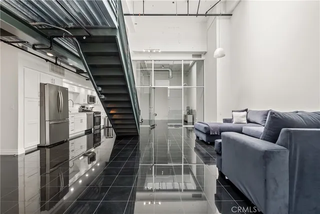 a living room with furniture and a rug