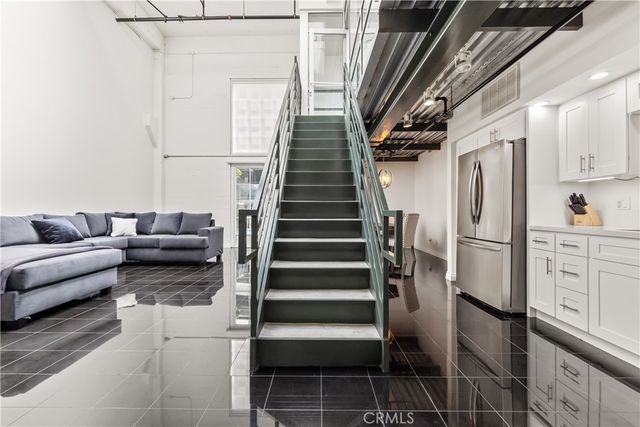 a kitchen with stainless steel appliances granite countertop a stove cabinets and a microwave