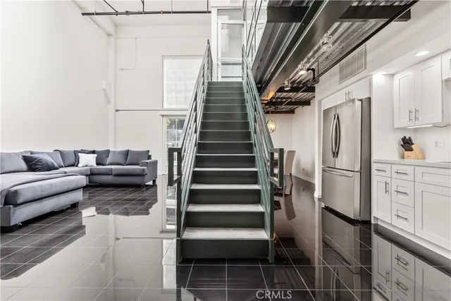 a kitchen with stainless steel appliances granite countertop a stove cabinets and a microwave